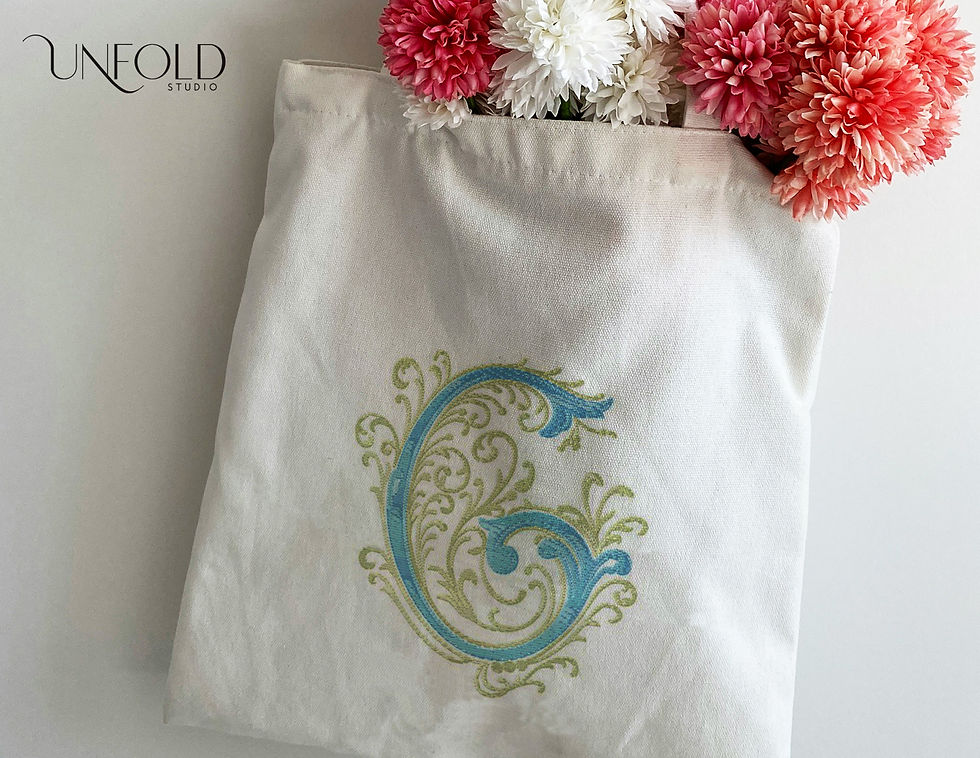 Thumbnail: Embroidered-style decorative letter G with elaborate swirls and scrolls, featuring intricate, flowing designs.