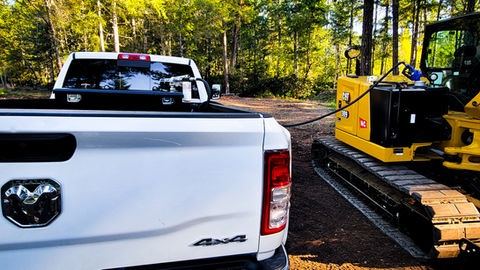 transferring fuel to excavator 