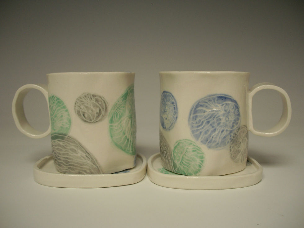 Porcelain mugs with medusa design