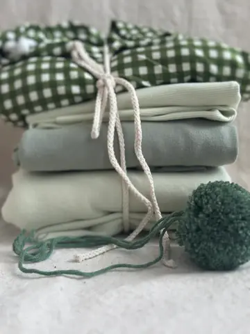 I pile of organic fabrics from I See Fabric - Organic Fabrics