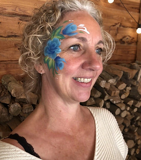 woman with rose face paint