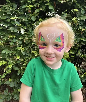 boy with butterfly face paint