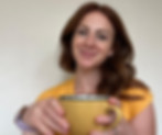 CORALIE W COACHING owner drinking a hot drink
