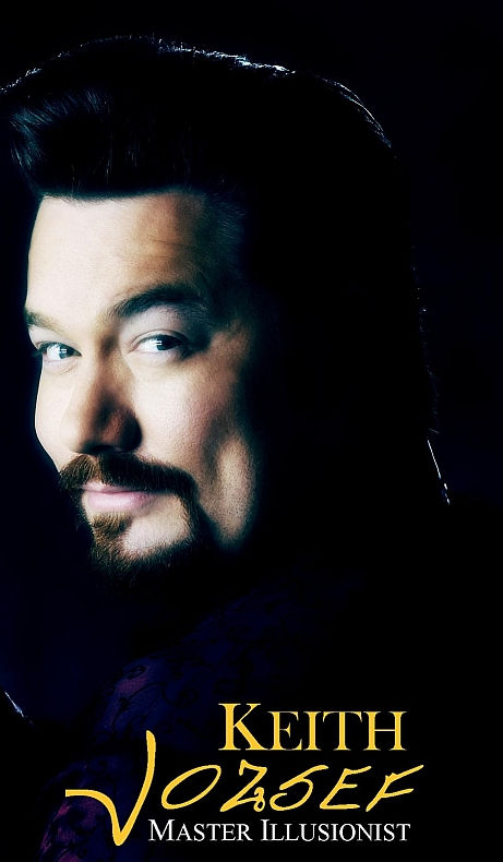 Professional portrait of Keith Jozsef, Master Illusionist, wearing a velvet jacket against a black background.