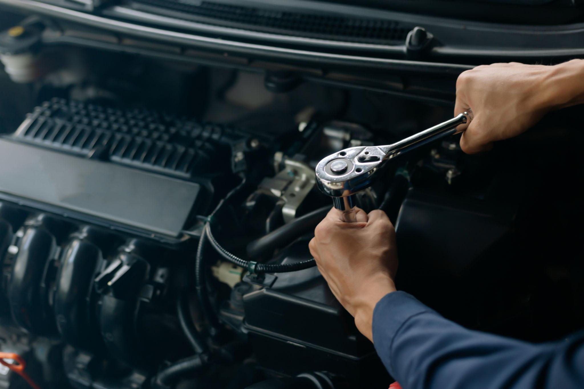 Mechanic performing engine tune-up