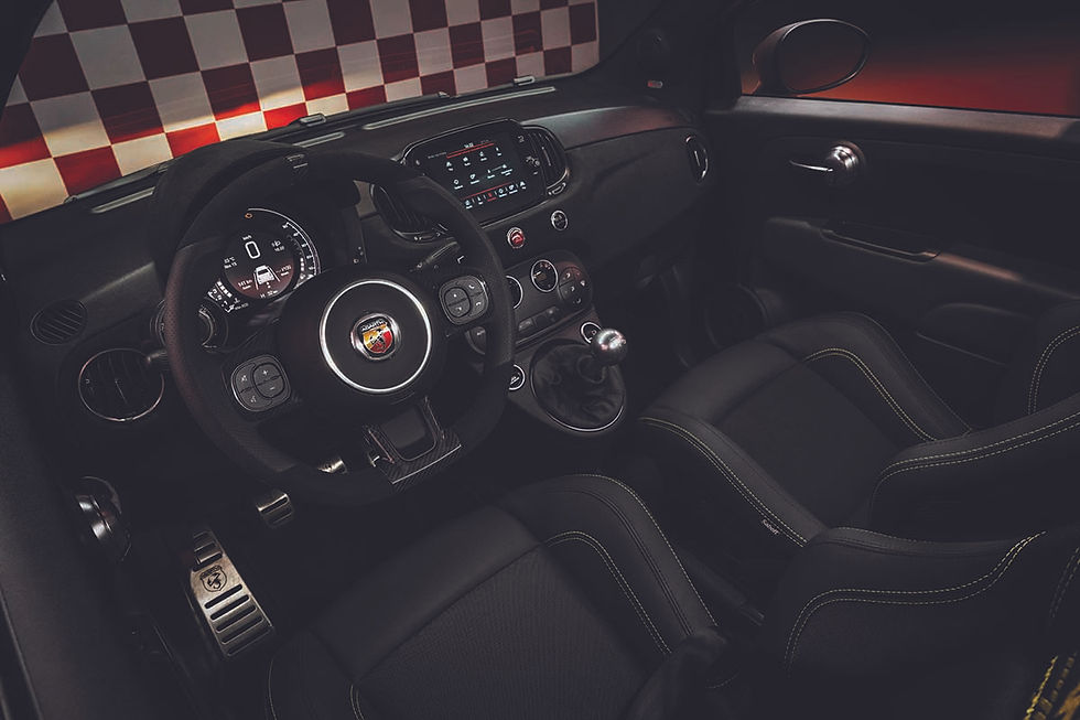 The interior features Sabelt carbon seats as part of a driver-focused cockpit
