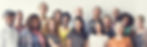 a diverse group of people smiling at the camera