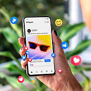 Picture of a person using social media on their phone