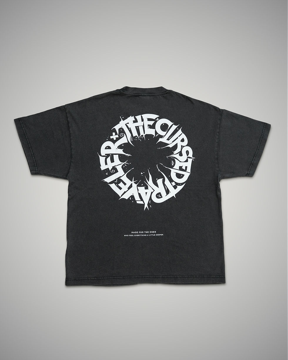 Black t-shirt with white graphic design on a gray background