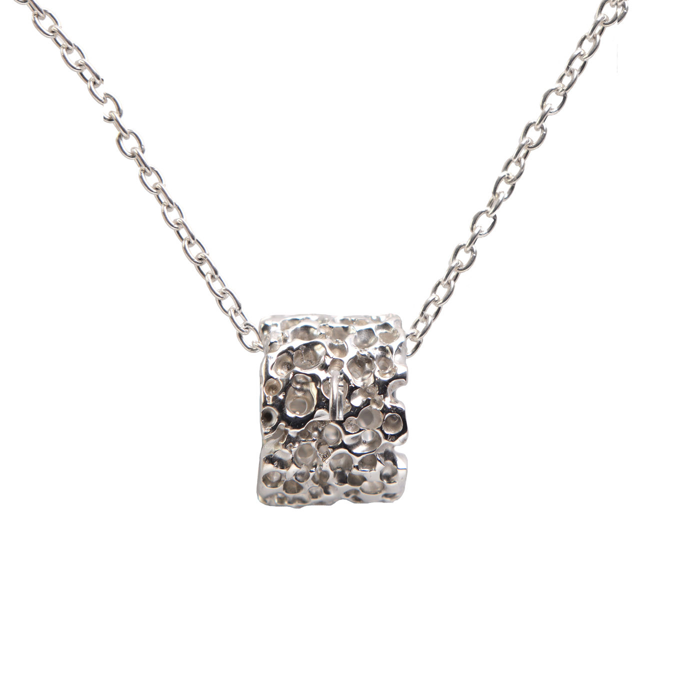 Underwater-inspired silver pendant with intricate patina and texture, Seaborn Ruins design