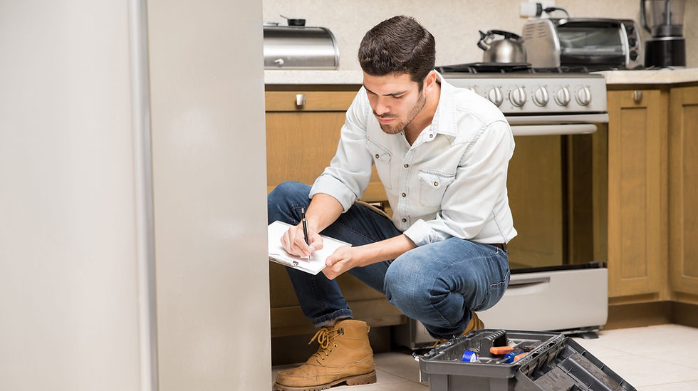 portrait-handsome-male-technician-doing-work-report-broken-fridge-home-kitchen (1)_edited_