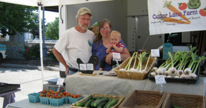 Carrie and family at the Cedar Lane booth