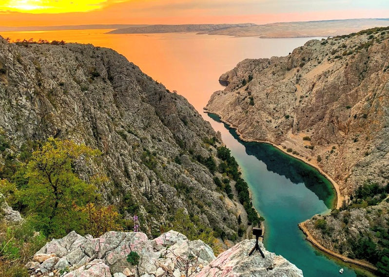 Private tours in the Balkans - Mesmerizing sunset reflection on Zavratnica's clear waters