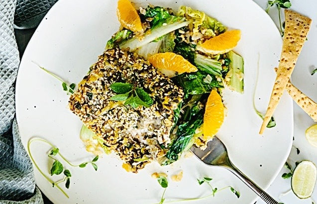 Sesame crusted fish with lemon zest and Asian greens.