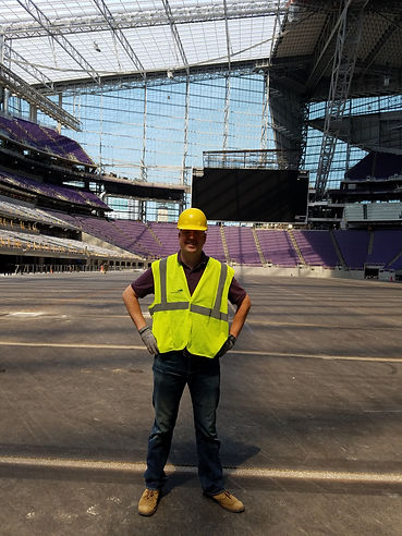 Clark touring US Bank stadium whil eit was under construction