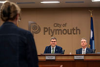Clark leading a council meeting