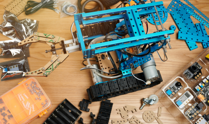 blue components for building a robot on a wood table