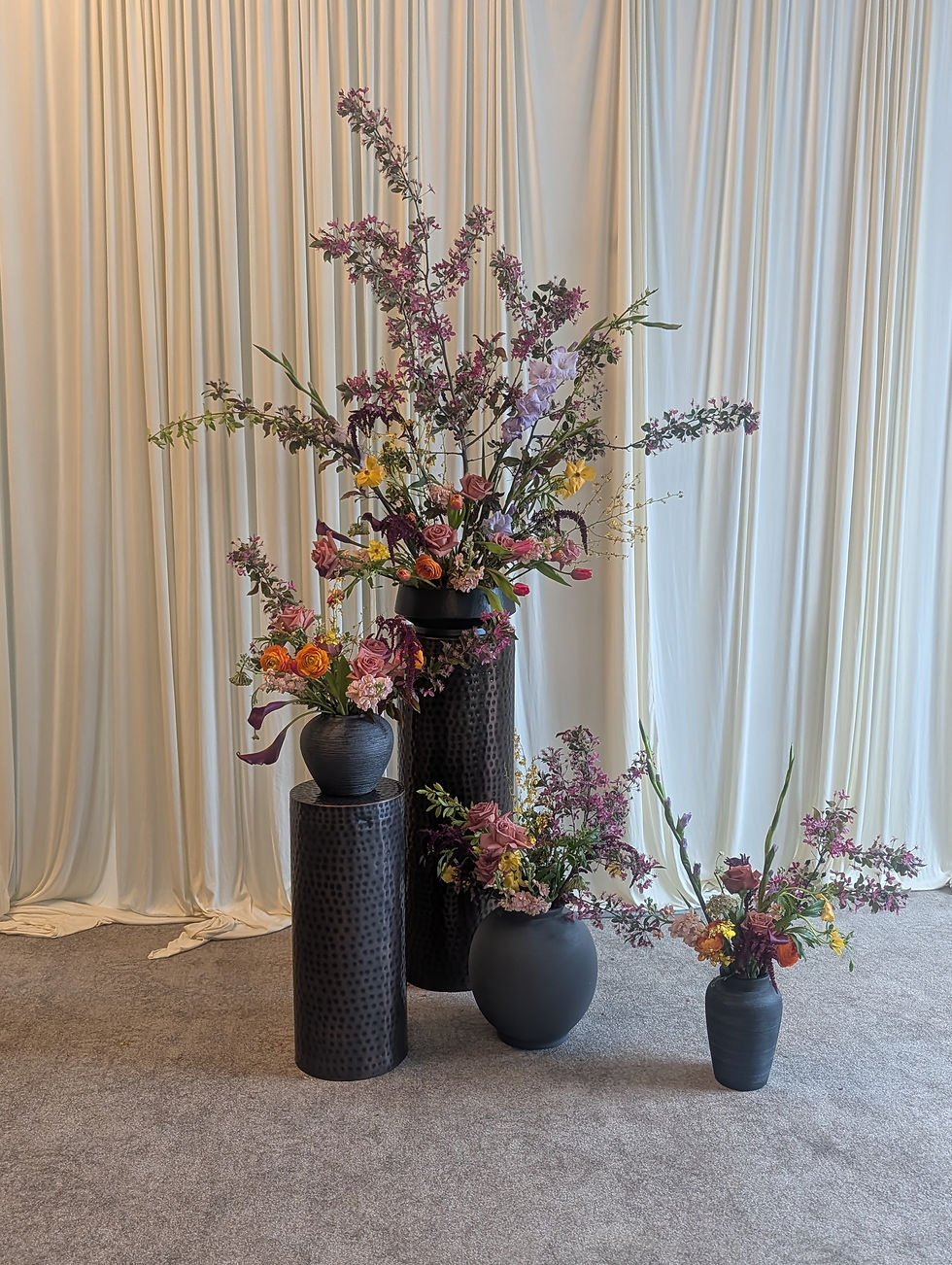 Floor flower arrangements at a wedding at the Italian American Club. Music by Rondo String Quartet.
