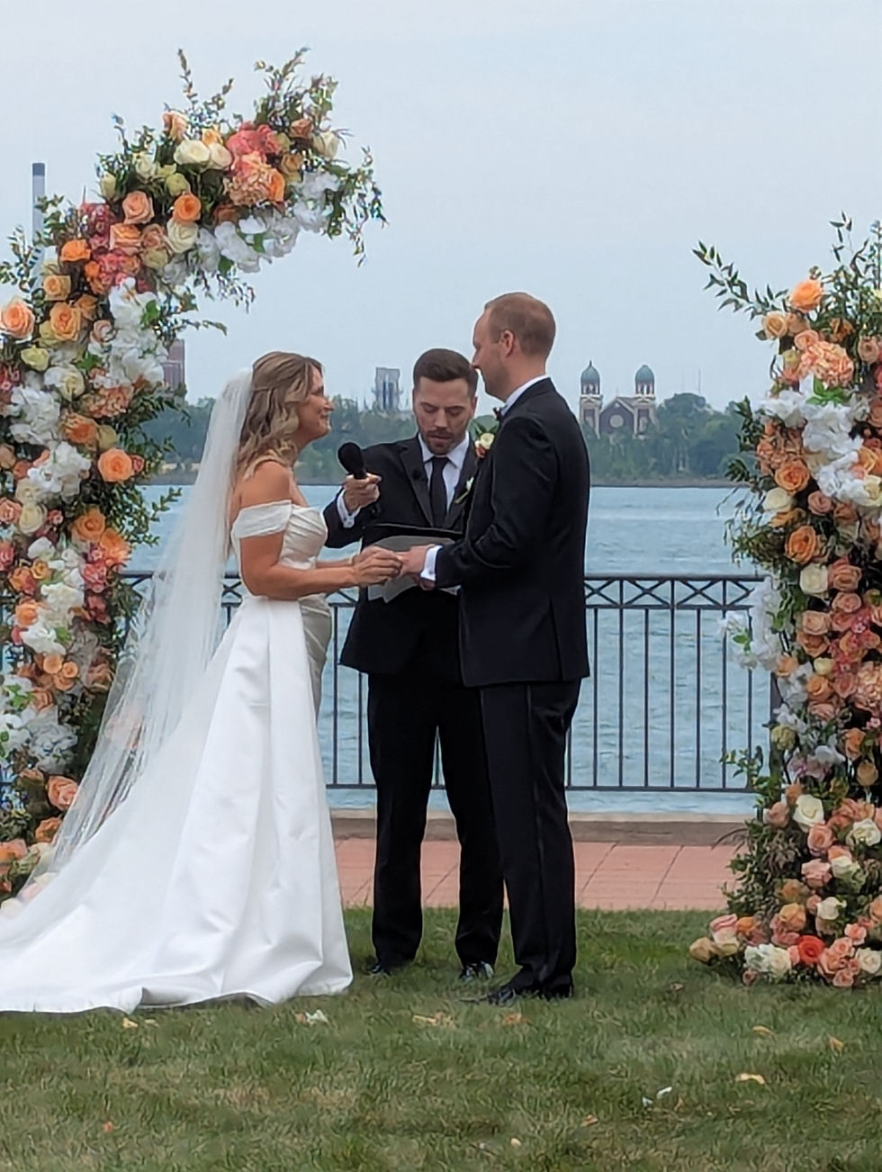 Mike Deck officiates the wedding of Jonathon and Lauren at The Icon's Riverfront Venue.