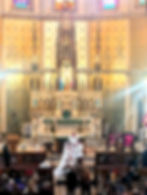 Stephen placing the ring on Marissa's finger.