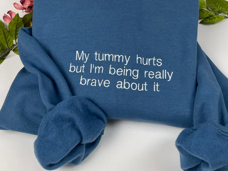 My Tummy Hurts Embroidered Sweatshirt: A Playful Expression of Discomfort