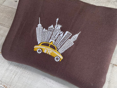 Stay Cozy and Stylish in our New York Embroidered Curry Crewneck Sweatshirt