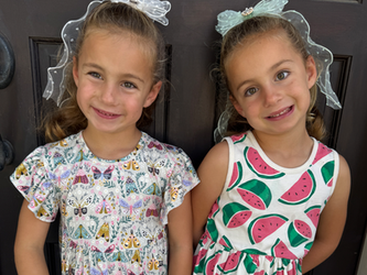 twin sisters smiling