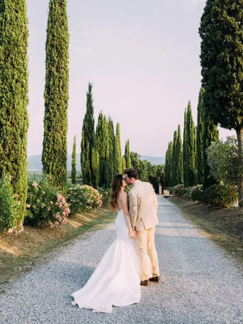 couple walking tuscany wedding
