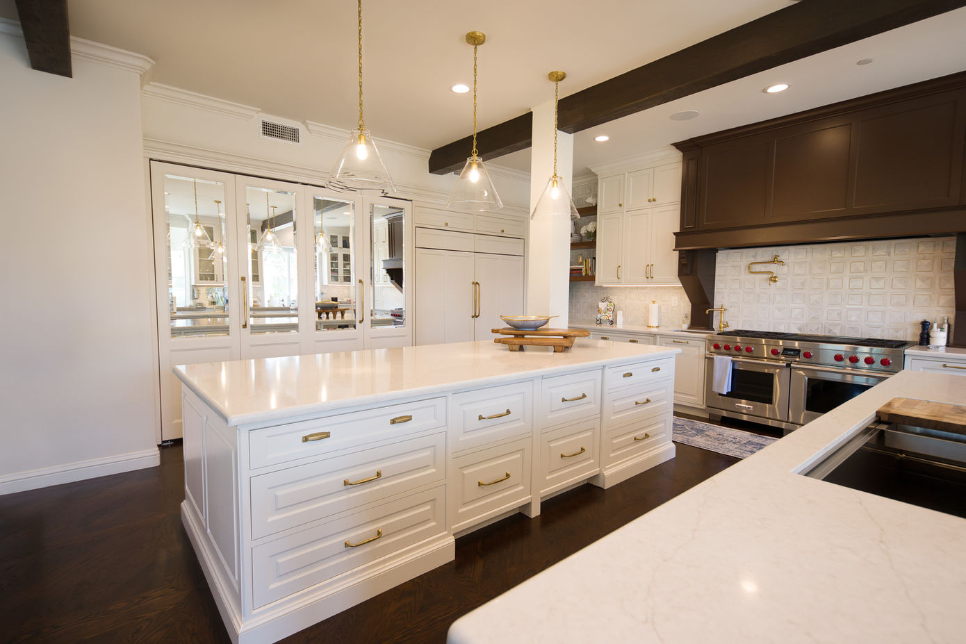Large kitchen island with custom storage and premium cabinetry