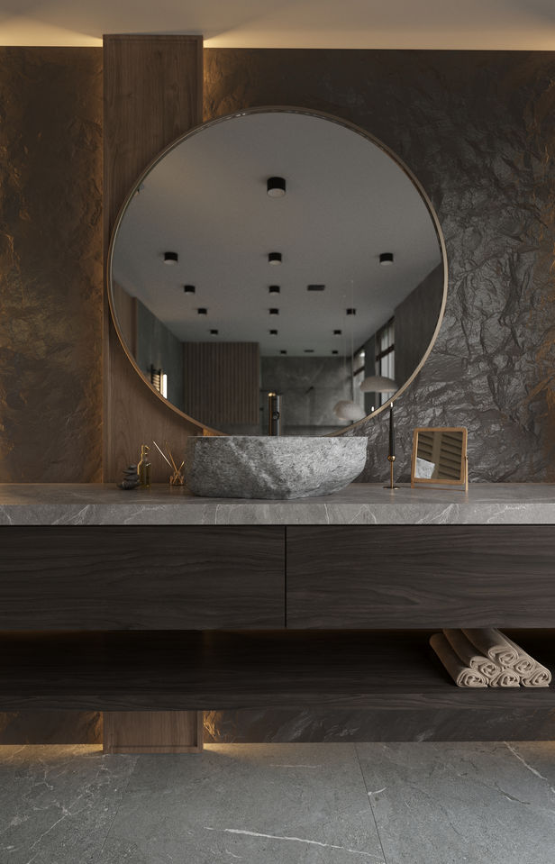 Modern bathroom design with a large circular mirror and Legourmet Kitchen.