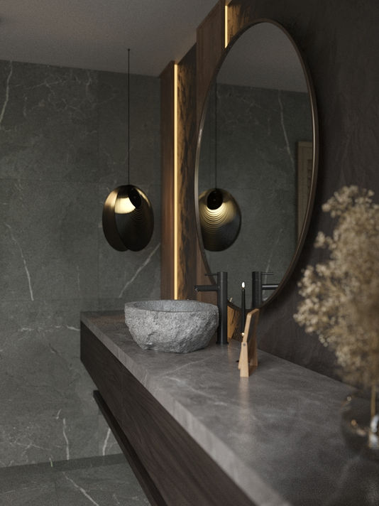 Modern bathroom with a stone sink, mirror, and decorative lighting