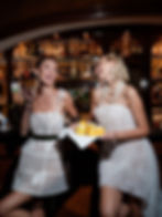Bridesmaids enjoying wedding reception with professional makeup styling