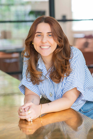 Smiling portrait of Wonderflo founder, an unconventional wedding planner for destination weddings in Europe.