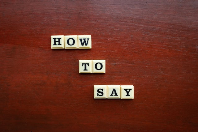 Scrabble letters that spell out "How to Say."