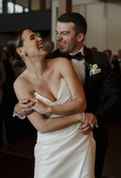 bride and groom smiling and dancing