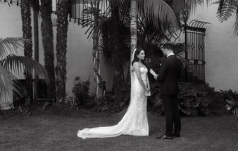 A groom reading vows to his bride