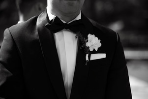 close up of groom's suit
