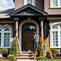 picture of black man painting exterior of a luxury home.jpg