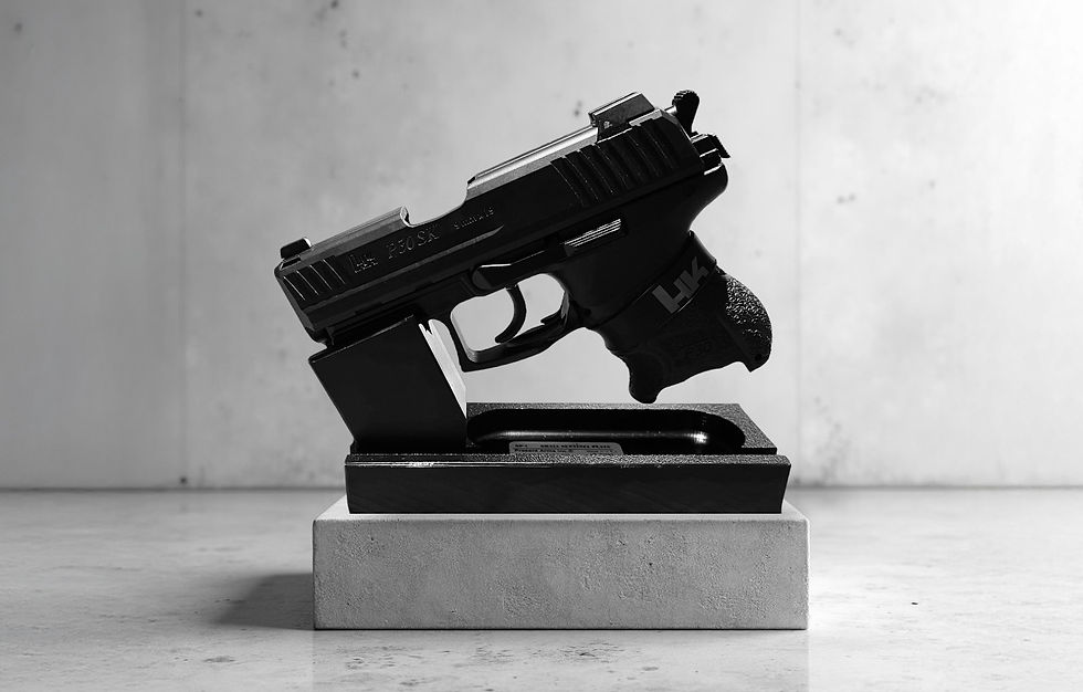 Close-up view of a firearm barrel being cleaned with a brush