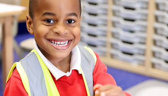 Child with hi-vis jacket on