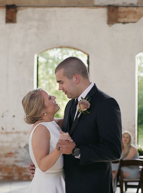 Bride and groom dancing at Providence Cotton Mill in Maiden, NC | Total Weddings