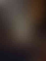 A vertical sage green art print features a pink bunny character tucked into an oversized, olive-green patterned jumper