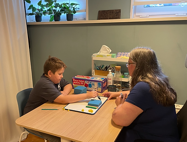 achild having maths tutoring at Illumnify Tutoring using base 10 materials