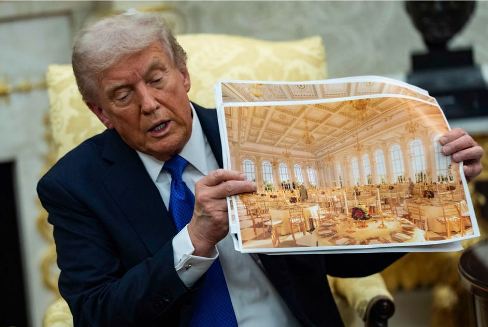 Trump holding a photo of the future ballroom