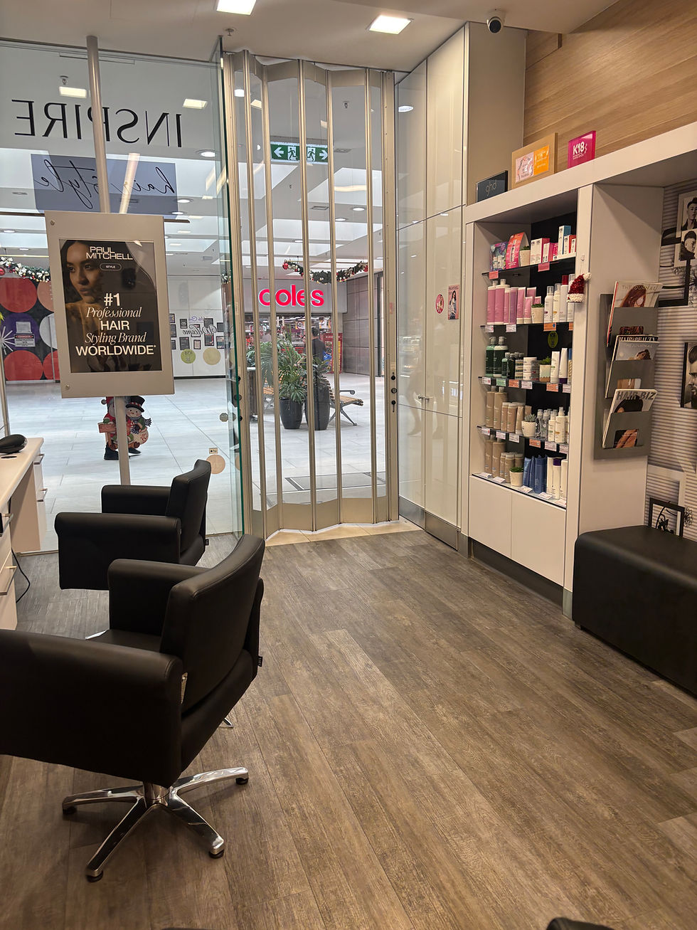 Eye-level view of a modern hair salon interior with styling chairs and mirrors