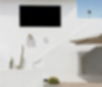 White minimalist building with cacti, small palm tree photo