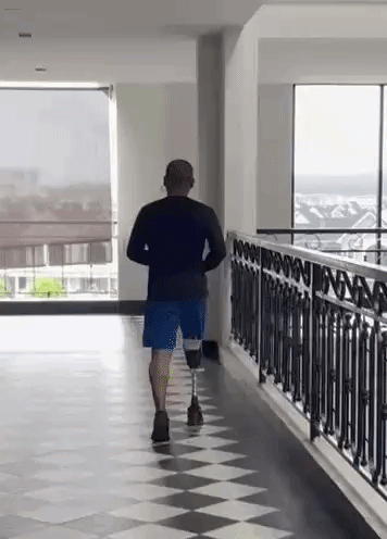 Person with transtibial prosthesis test jogging