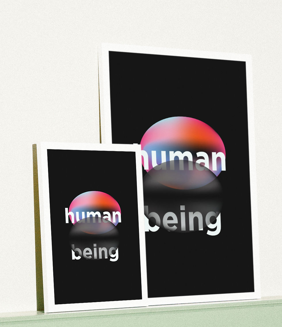 Two framed posters display 'human being' with colorful gradients on a black background.