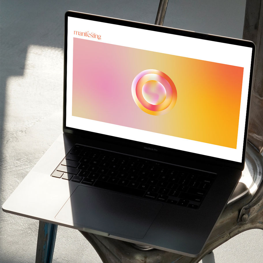 Laptop displays website with the logo The O, on silver chair