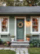 Exterior with Olive Grove paint by Sherwin-Williams and black window frames.